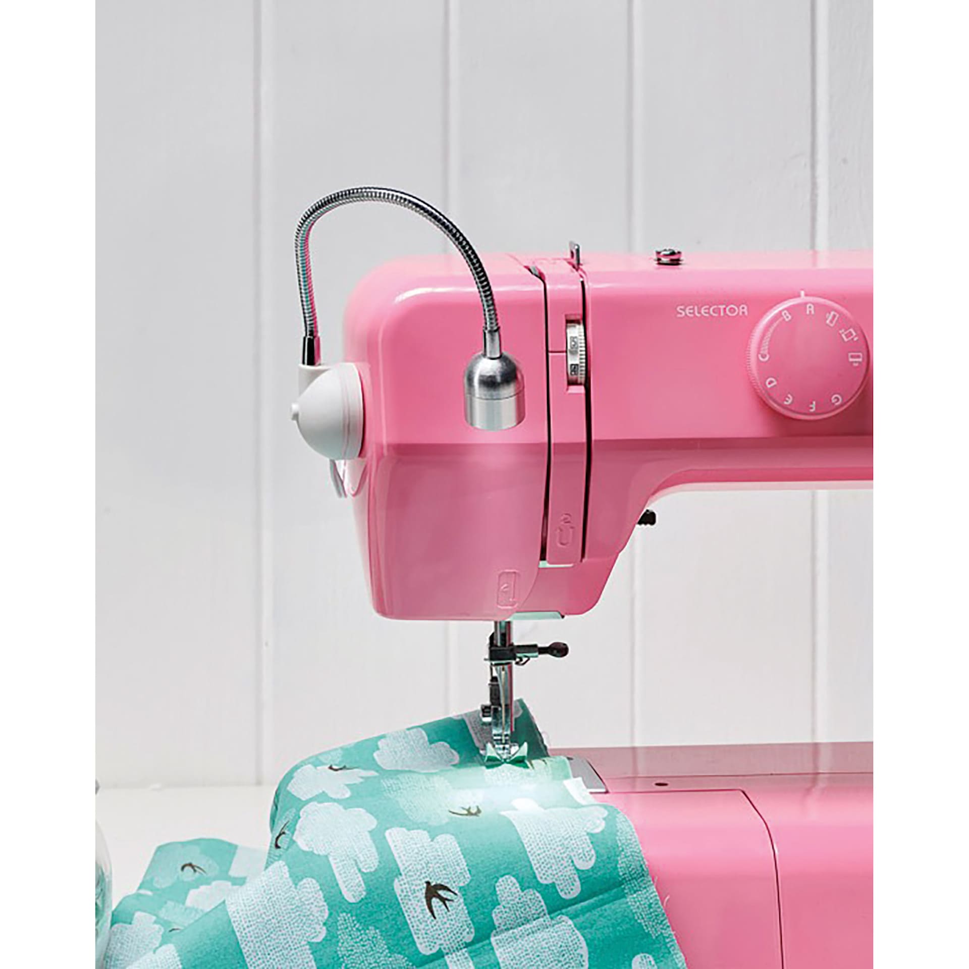 Daylight Sewing Machine Lamp - in use, attached to a pink sewing machine