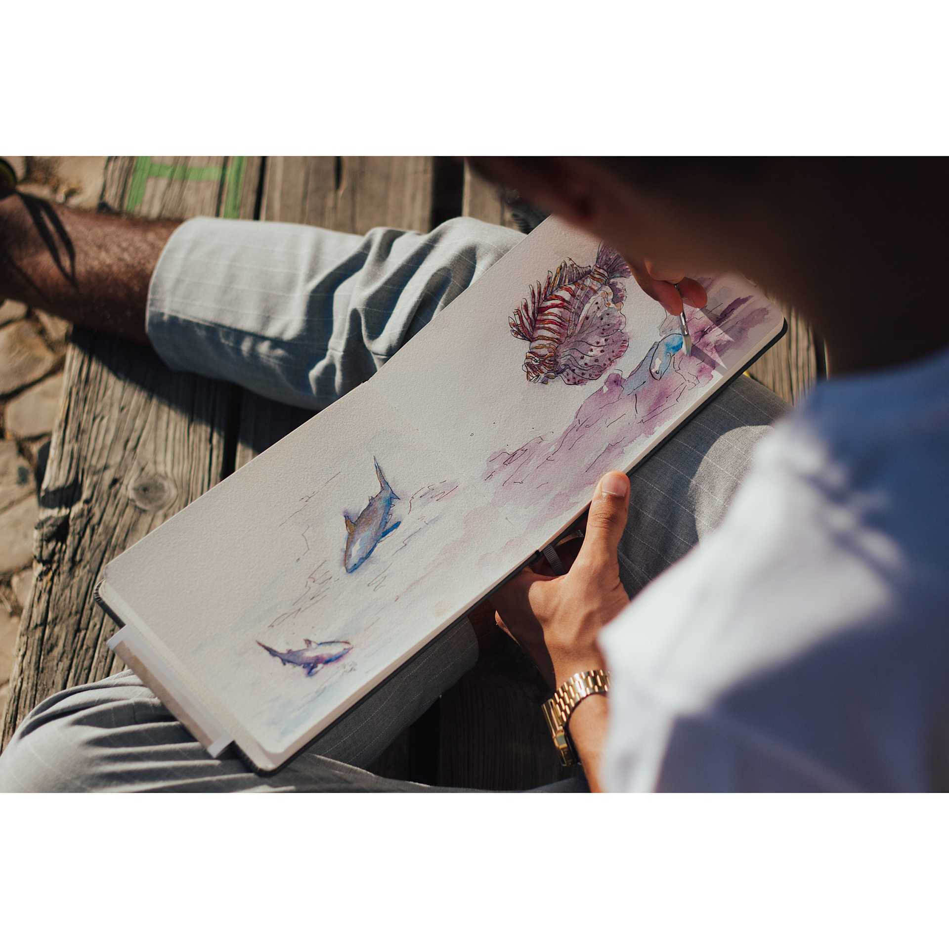 Etchr The Perfect Sketchbook (person using washes of watercolor to paint fish) Etchr The Perfect Sketchbook (person using washes of watercolor to paint fish)