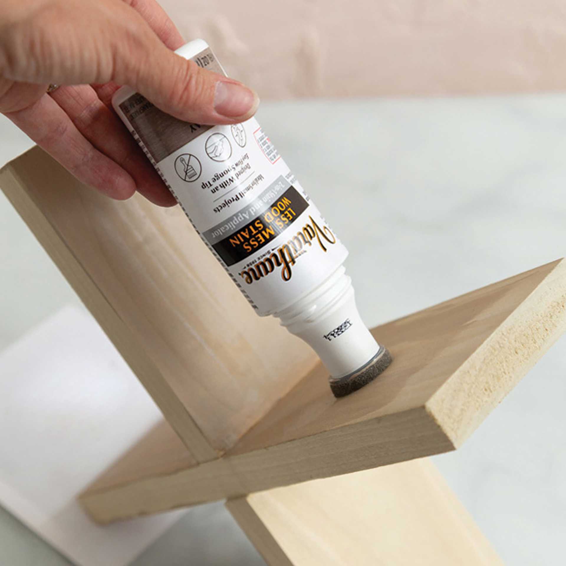 Varathane Less Mess Wood Stain - Gray, 4 oz bottle being used on a shelf