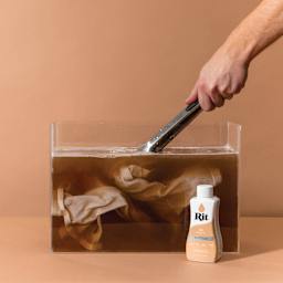 Rit All Purpose Liquid Dye - Tan, 8 oz, submerging fabric in dyed water
