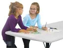Kwik-Cover Tablecloths - 2 students painting with watercolors on covered table
