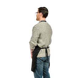 Back view of Blick Classic Black Apron with Logo on a person