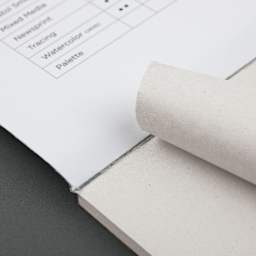 Blick Studio Newsprint Pad - 12" x 18", 100 Sheets, sheet being torn from pad