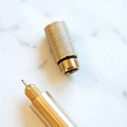 Tom's Studio Lumos Mini Refillable Pen - Solid Brass, close-up of pen and cap