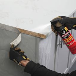 DAP Weldwood Original Contact Cement Spray Adhesive - 14 oz being applied to countertop