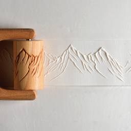 MKM Pottery Tools Large Handle Roller - Mountain Range applied to clay
