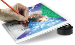 Artograph PadPucks - Shown propping up board at angle for painting