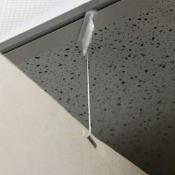 StikkiWorks Ceiling Hanglers Grid Clip Kits - Closeup of Clip in Ceiling