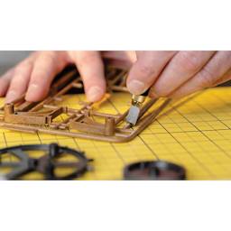 Olfa Chisel Art Blades - chisel being used to carve out 3D printed assets from supports