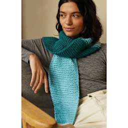 DMC Mindful Making Serene Scarf Beginner Knitting Kit - person wearing finished scarf