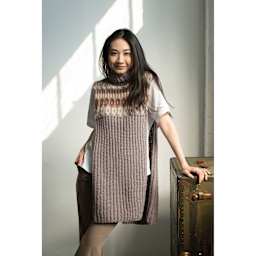 Lion Brand Re-Spun Yarn, adult wearing long shirt made out of yarn