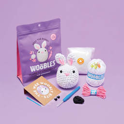 The Woobles Beginner Crochet Amigurumi Kit - Bunny, contents and finished design laid out