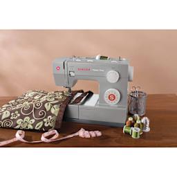 Singer Heavy Duty 4423 Sewing Machine, sewing notions next to machine