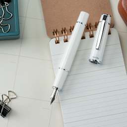 Pilot Prera Standard Fountain Pen - Porcelain White, Fine, cap off with notepad (not included)