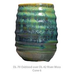 DL-70 Oxblood over DL-42 River Moss. Cone 6.