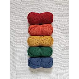 Lion Brand Cottino Yarn available colors organized together in a rainbow